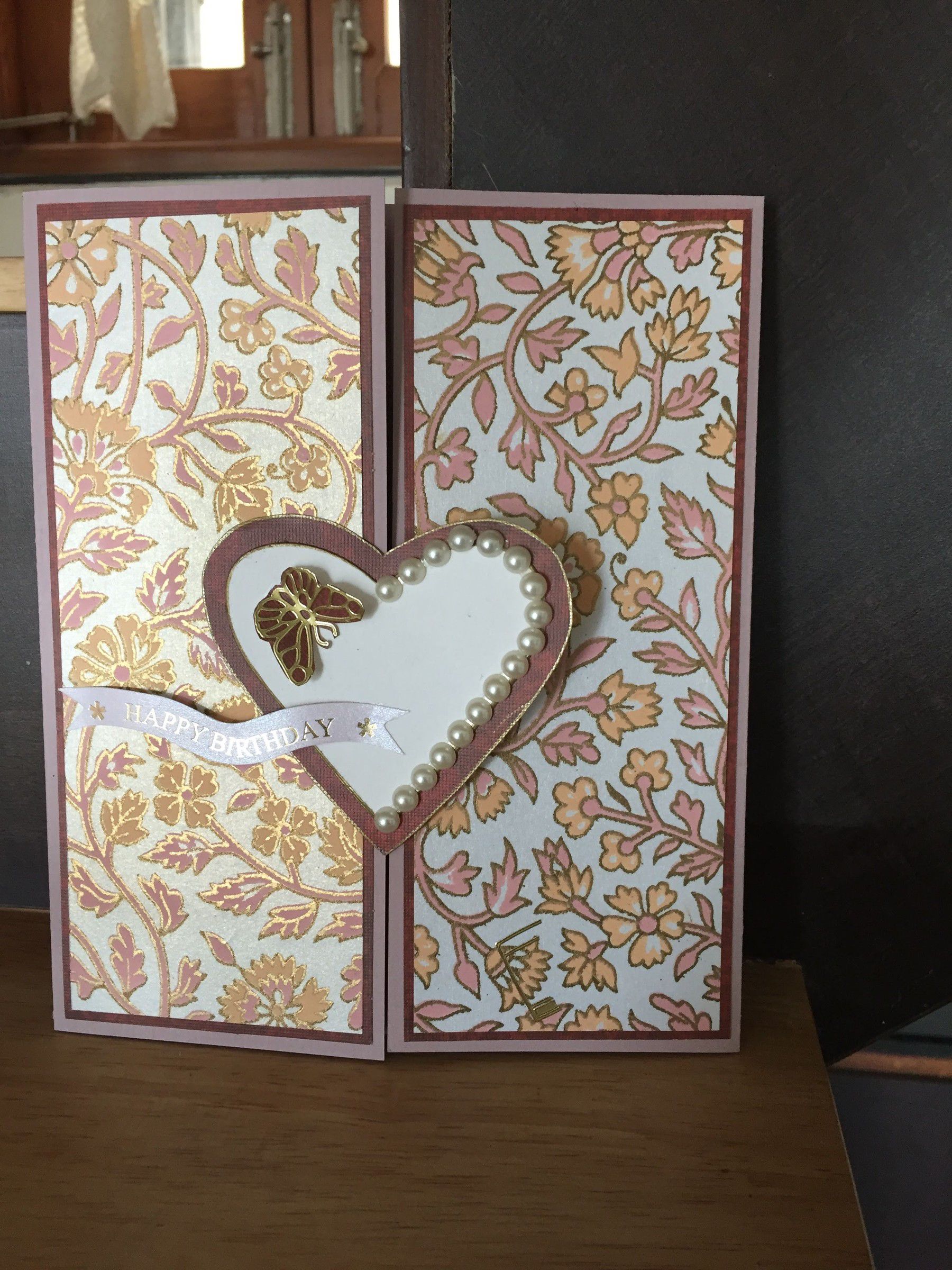 Gatefold birthday card in pink and gold floral paper, with a pearl-edged heart and a Happy Birthday banner