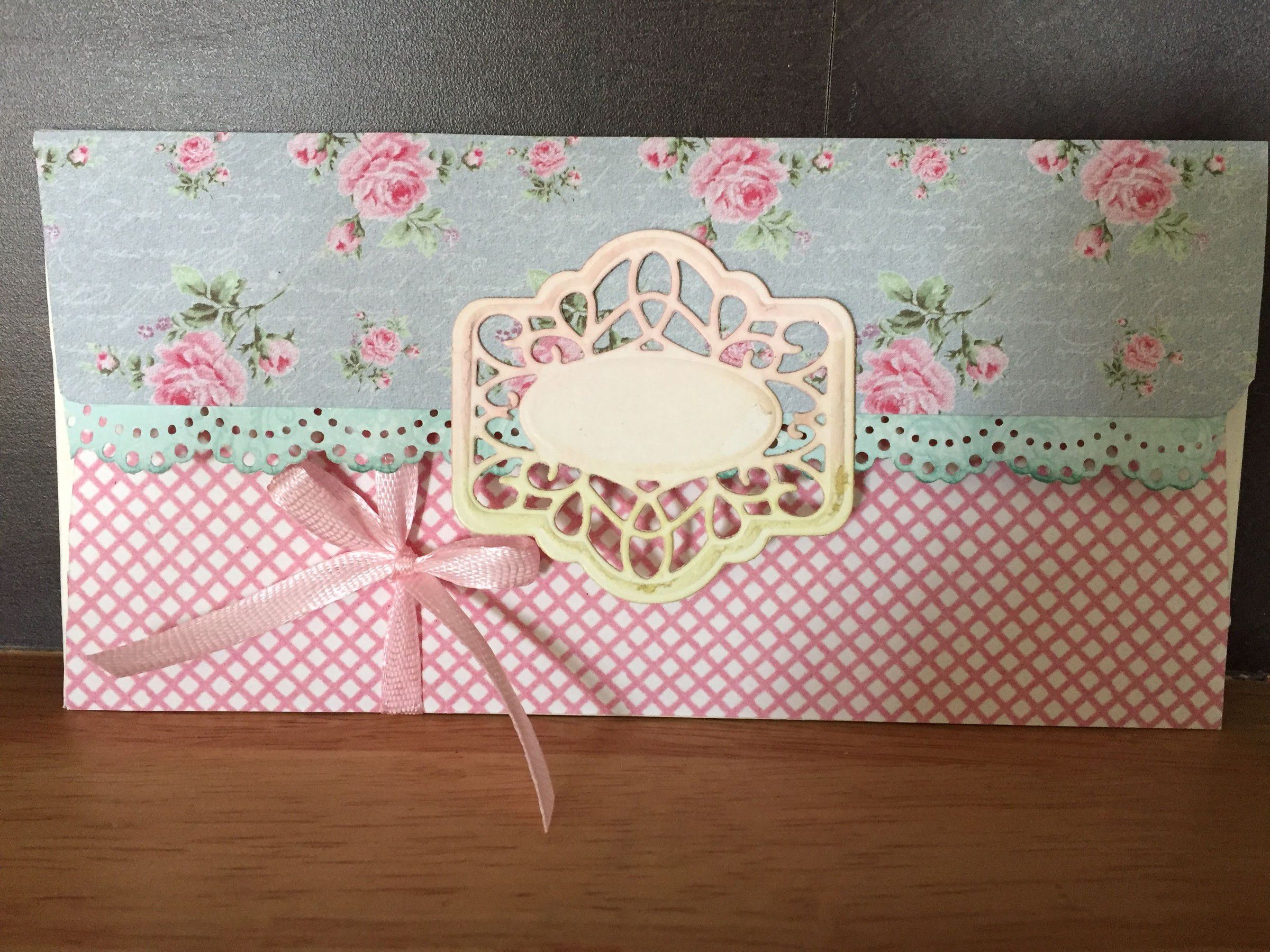 Handmade envelope in pink rose-print and lattice papers, tied with a pink ribbon bow